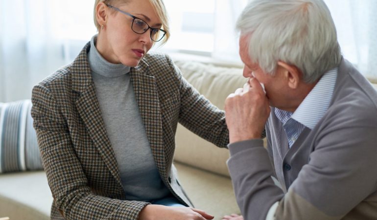 clinician client woman sad couch