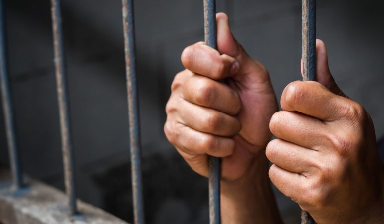 jail bars hands prison