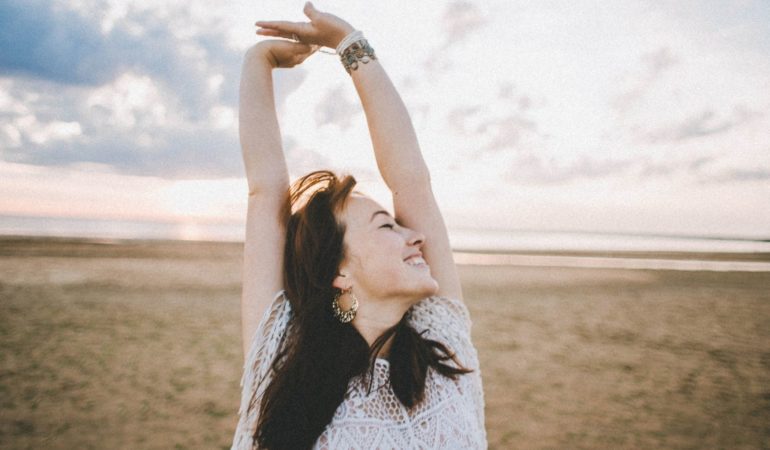 woman stretching smile letting go joy happy