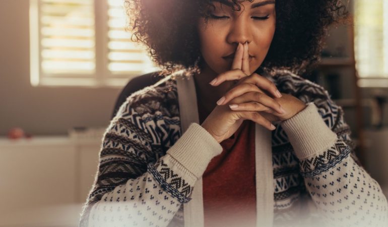 woman fingers peace thoughtful