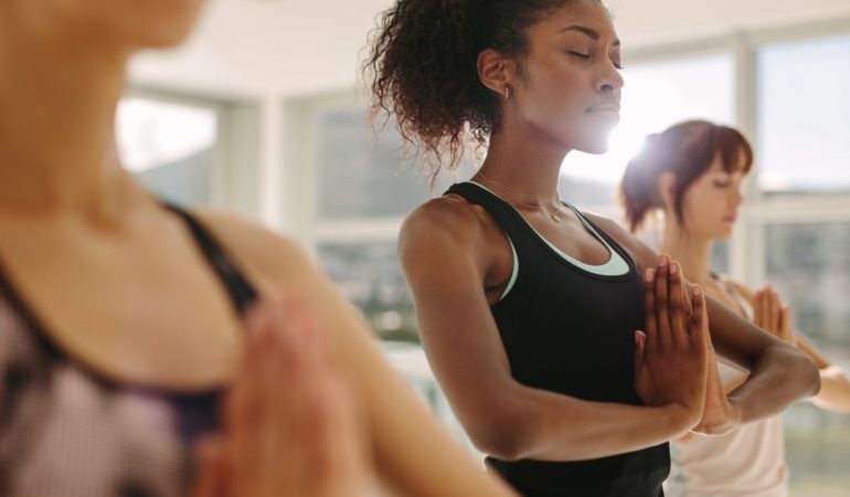 woman yoga meditation hands together