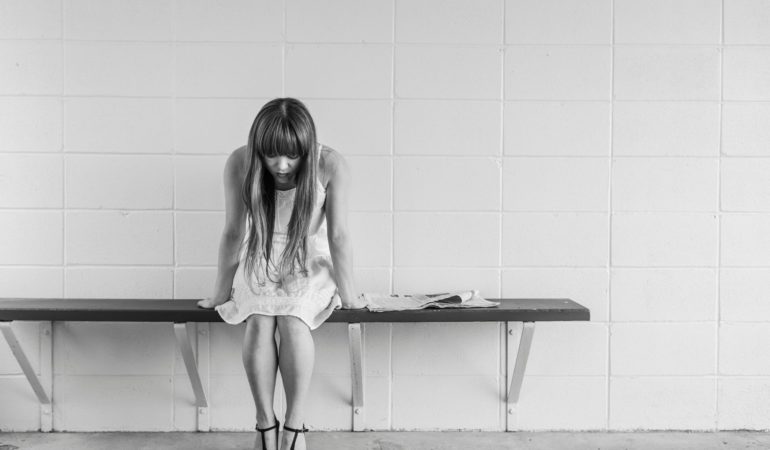 woman sit bench black and white