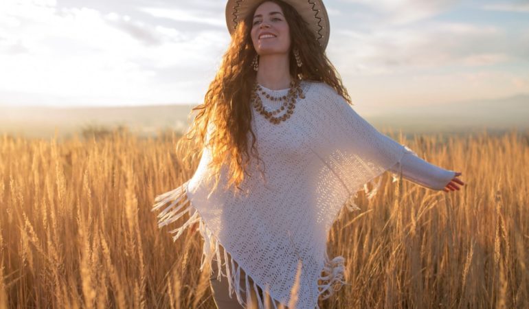 woman field hat happy