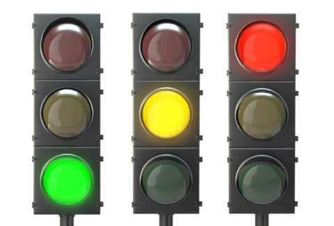 Set of traffic lights with red, yellow and green lights