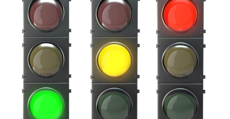 Set of traffic lights with red, yellow and green lights