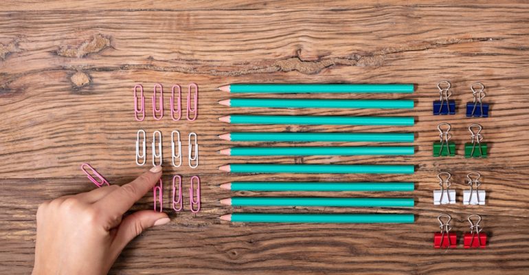 Person Arranging The Paper Clips