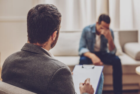 Upset male person being deep in thoughts