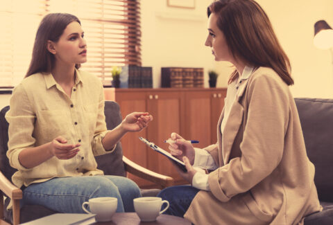 Professional psychotherapist working with patient in office