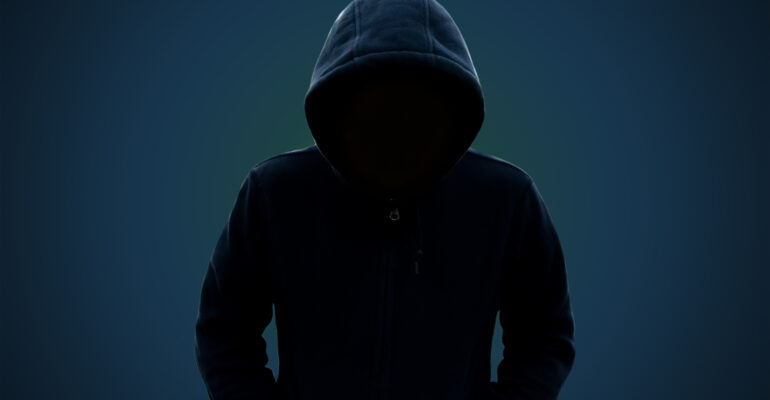 A hooded man with no face: concept of suspicion in person, theft