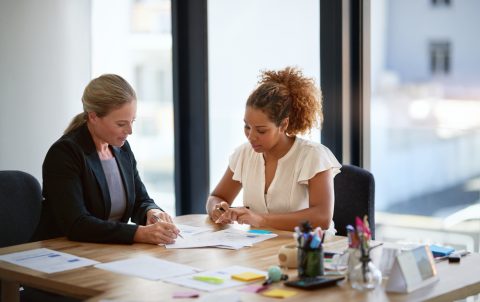 Documents, meeting and business people in office for discussion, legal consulting and agreement. Corporate lawyer, law agency and women and paperwork for client contract, collaboration and report