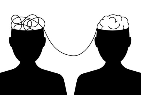 mental health concept. Siduet of a two male heads with a brain and a tangled tangle of thoughts